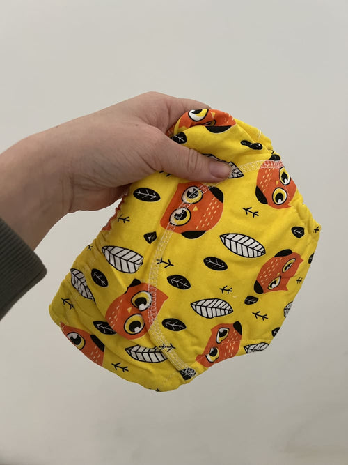 Culotte d’apprentissage jaune motif chouette utilisée par un client satisfait.