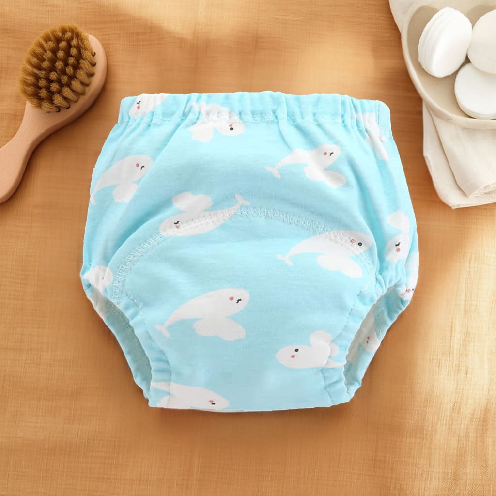 Culotte d’apprentissage bébé bleue avec motifs baleines blanches