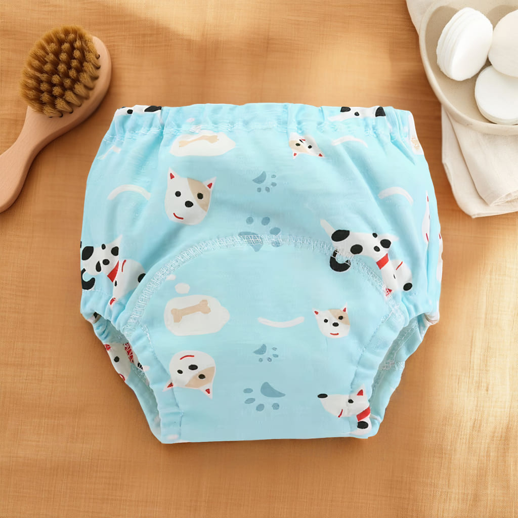 Culotte d’apprentissage bébé bleue avec motifs petits chiens