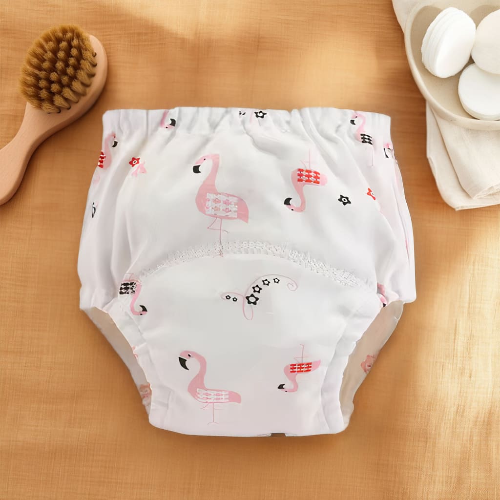 Culotte d’apprentissage bébé blanche avec motifs flamants roses
