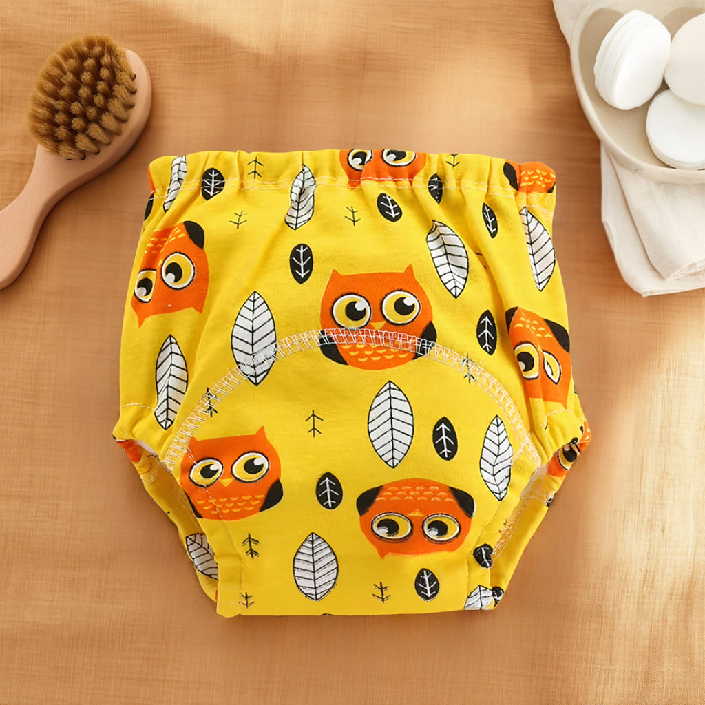 Culotte d’apprentissage bébé jaune avec motifs hiboux et feuilles