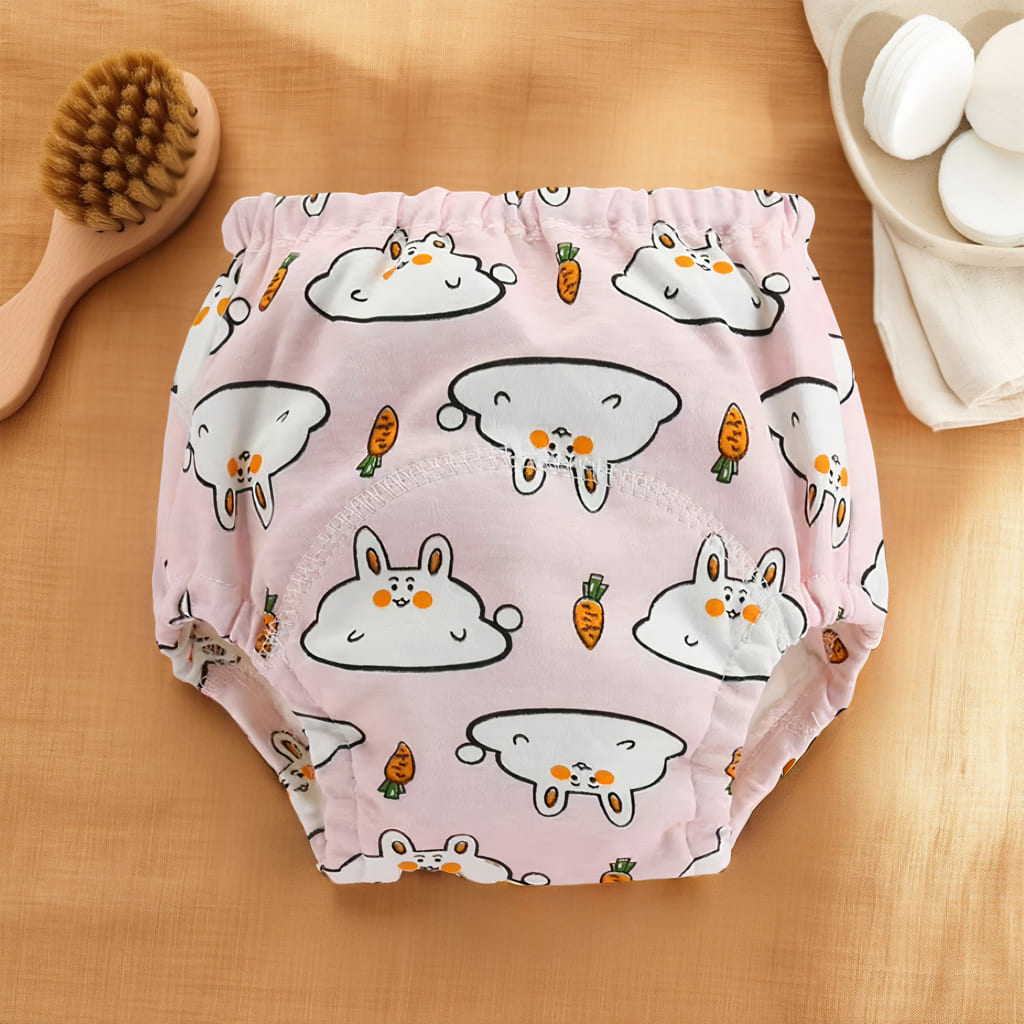 Culotte d’apprentissage bébé rose avec motifs lapins et carottes