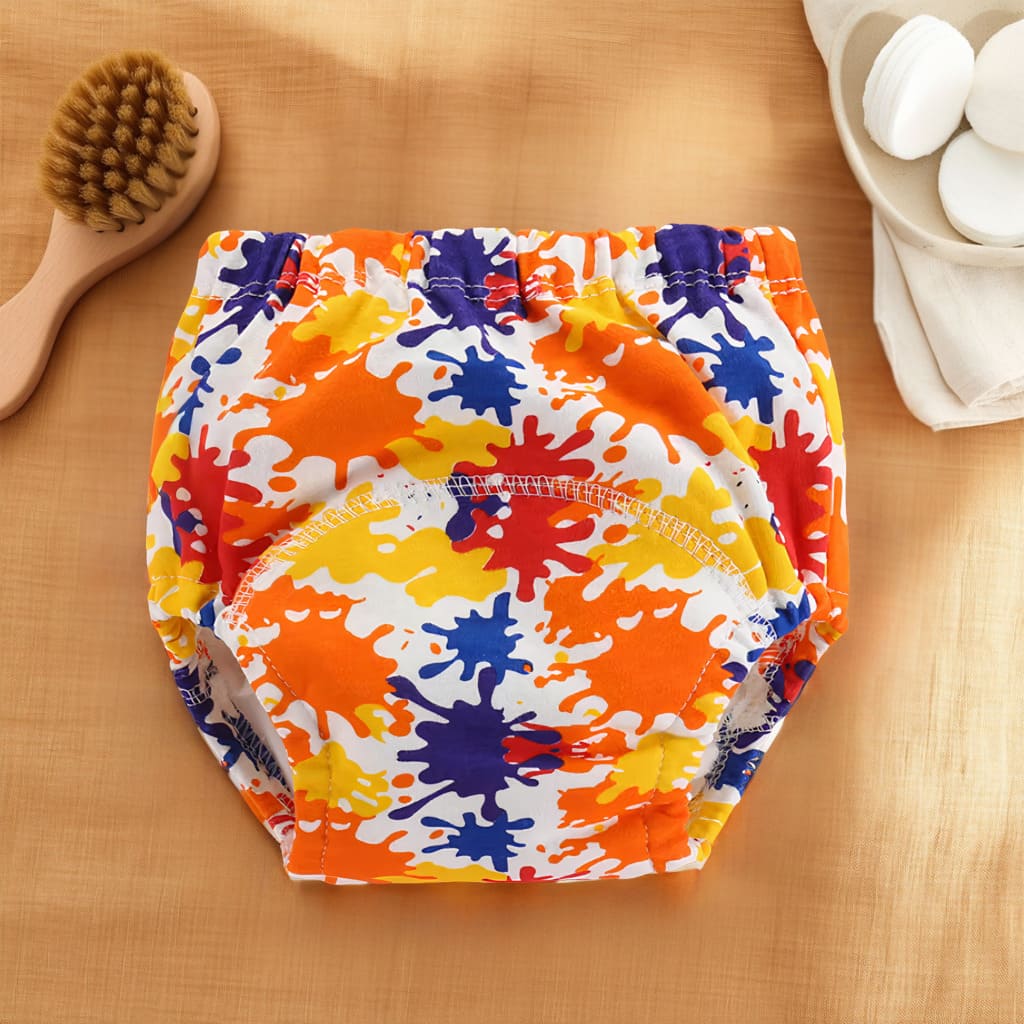 Culotte d’apprentissage bébé avec motifs éclaboussures de peinture colorées