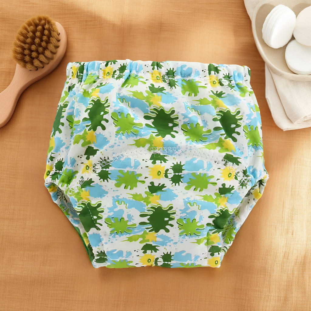 Culotte d’apprentissage bébé avec motifs éclaboussures vertes et bleues